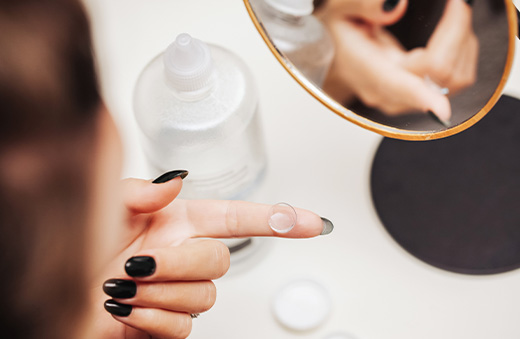 contact lens on tip of a finger
